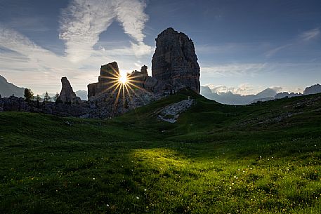 The sun rise between Cinque Torri peaks, Cortina d'Ampezzo, Cadore, dolomites, Veneto, Italy, Europe